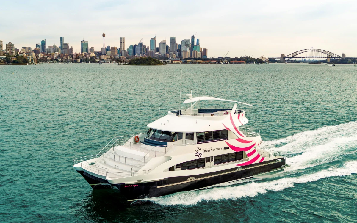 Boat on the water. City skyline.