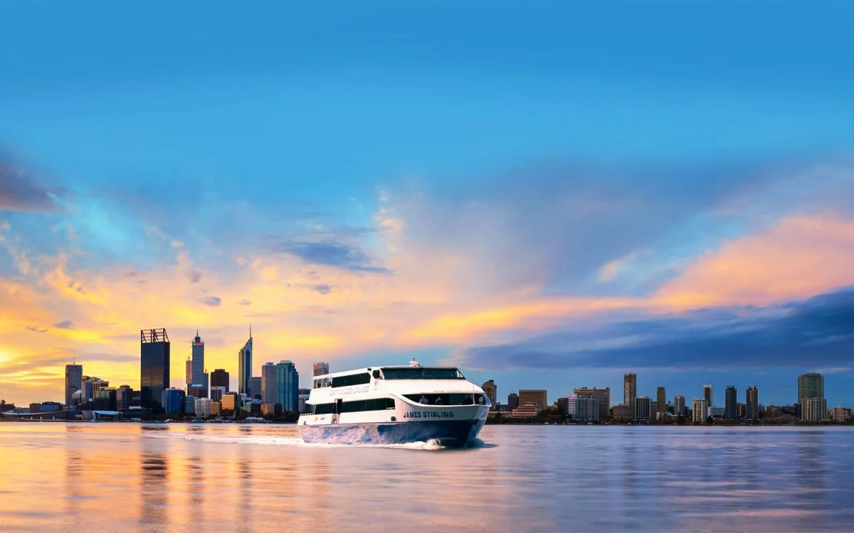 Boat on the water. City skyline.