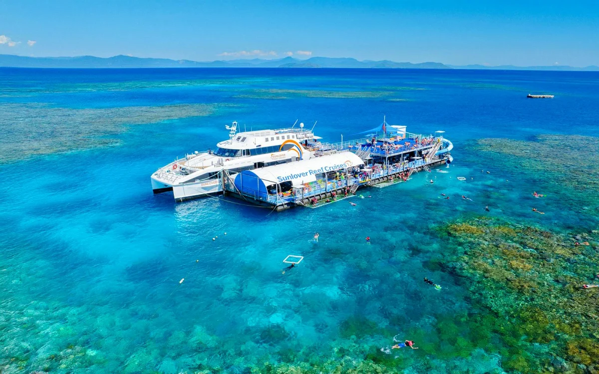 Snorkelling in the water. Boat on the water.
